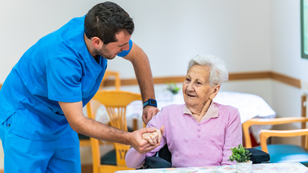 man in scrubs helps an older woman